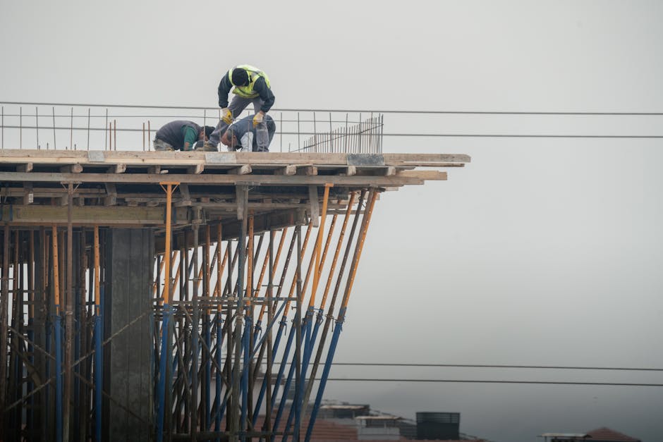 Workers on a high-rise building construction site in Denizli, Türkiye, showcasing teamwork and safety